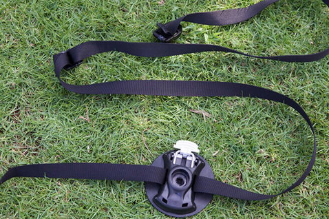 Duotone Adapter Strap for Base Plate in black on a grass surface