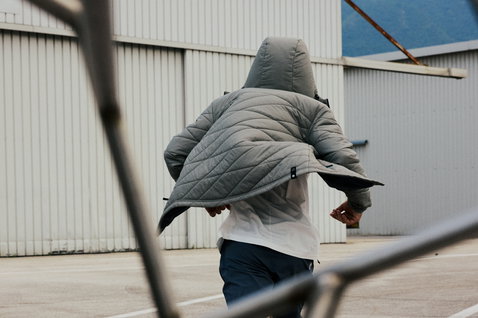 Duotone Explore insulated hooded jacket worn outdoors in dusty forest green