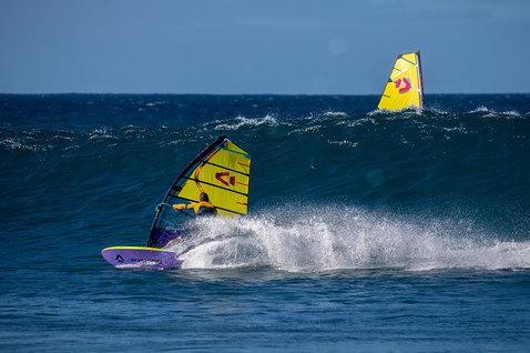 Duotone Grip [Tri] SLS windsurf board during wave riding in the ocean