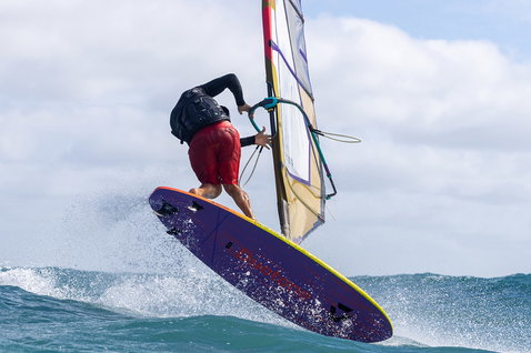 Duotone Ultra FreeWave SLS windsurf board during wave riding on the ocean