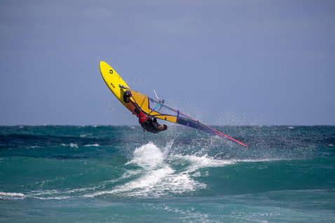Duotone Ultra FreeWave SLS windsurf board during wave riding at the ocean beach