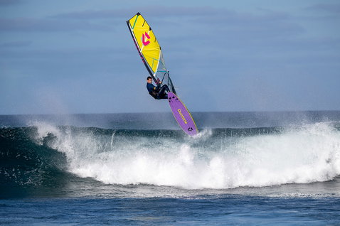 Duotone Ultra Grip [Quad] windsurf board during wave riding at the ocean wave break