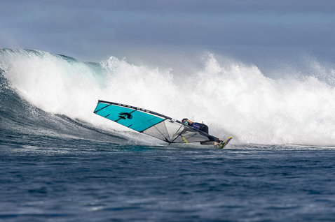 Duotone Super Hero D/LAB wave sail during wave riding at the ocean wave break