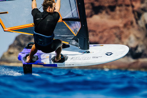Duotone Falcon Foil D/LAB windsurf board during foiling at ocean coastal cliffs