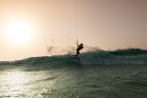 Duotone Whip SLS wave kiteboard wave riding on the ocean beach