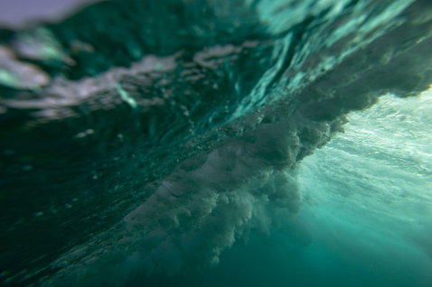 Duotone Volt SLS wave kiteboard wave riding in the ocean underwater