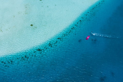 Duotone Volt SLS surfboard during kitesurfing in a tropical reef lagoon