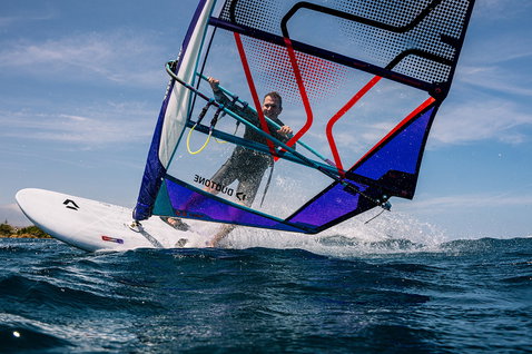 Duotone Blitz D/LAB windsurf board during windsurfing in the open ocean