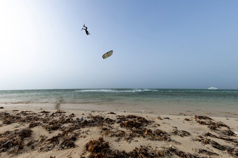Duotone Rebel SLS LEI kite during kitesurfing on the ocean beach
