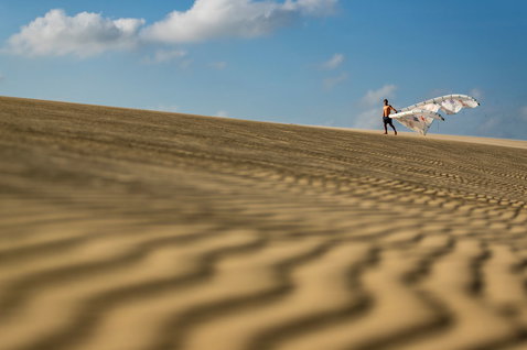 Duotone Evo SLS LEI kite during kitesurfing at sand dunes on the beach