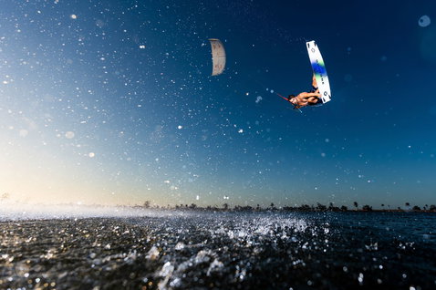 Duotone Evo SLS LEI kite during kitesurfing on an ocean beach and tropical lagoon