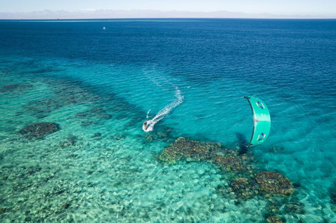 Duotone Evo SLS LEI kite during kitesurfing in a tropical ocean lagoon with shallow reef