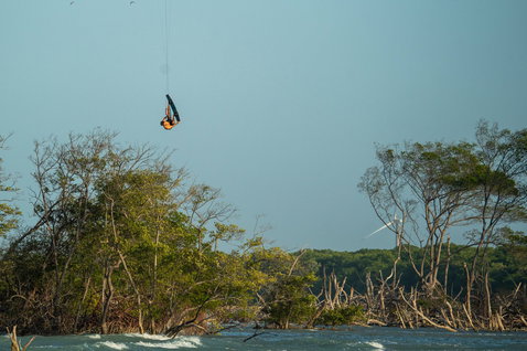 Duotone Evo SLS LEI kite during kitesurfing in a tropical lagoon with mangroves in Brazil