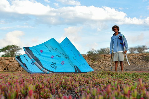 Duotone D/LAB LEI kite 10m during kitesurfing at a coastal rocky scrubland