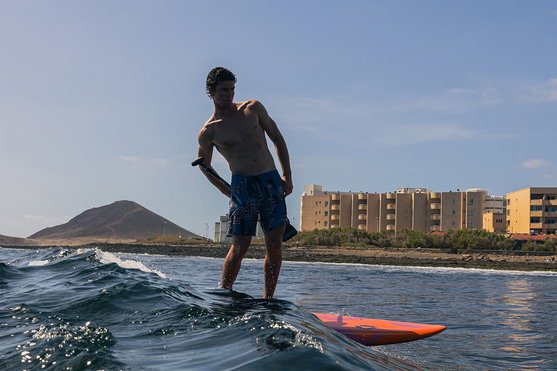 Duotone Cosmic SUP wave hardboard during wave surfing at the coast