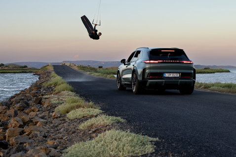 Duotone Jaime SLS Porsche Turbo Edition twin-tip kiteboard during kitesurfing on the coast at golden hour