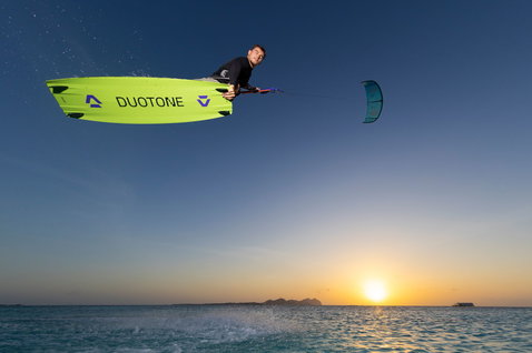 Duotone Evo D/LAB LEI kite during kitesurfing over the ocean at sunset