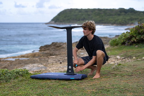 Duotone Crush SLS prone foil board with foil assembly during prone foiling on the coast of Guadeloupe