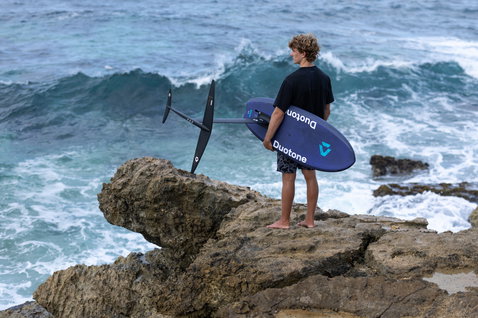 Duotone Crush SLS prone foil board during prone foiling on the rocky coastline of Guadeloupe