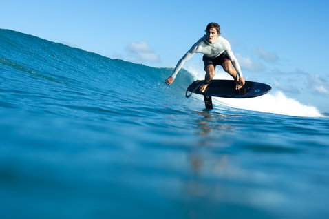 Duotone Crush SLS prone foil board during prone foiling on the ocean in Guadeloupe