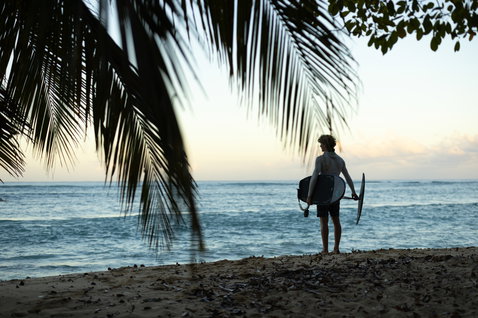 Duotone Crush SLS prone foil board during foiling session on the beach in Guadeloupe at dusk