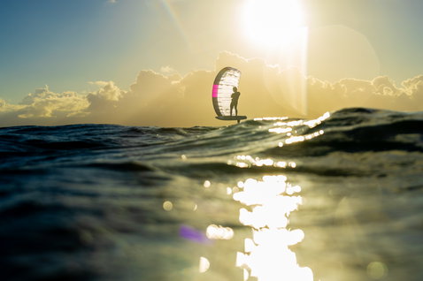 Duotone Crest SLS front wing during kite foiling on the ocean at golden hour in Guadeloupe