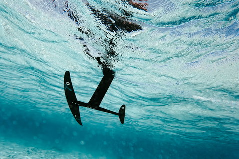 Duotone Crest SLS front wing during foiling in turquoise water at Union Island