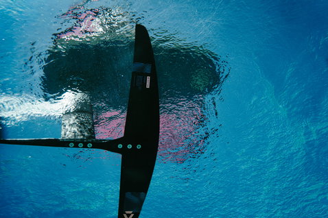 Duotone Crest SLS front wing during foiling in tropical ocean waters viewed from above