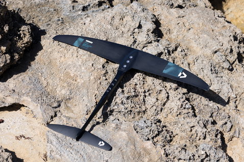 Duotone Crest SLS front wing on rocks in carbon black and teal