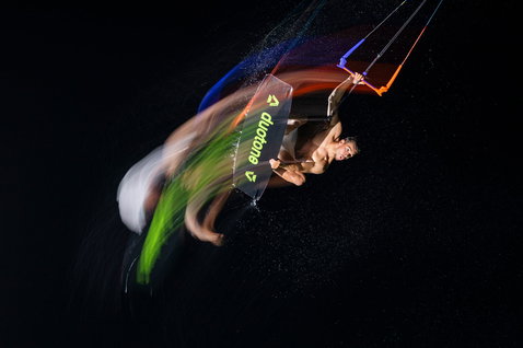 Duotone Trust Bar Quad Control control bar during kitesurfing in dramatic studio action shot