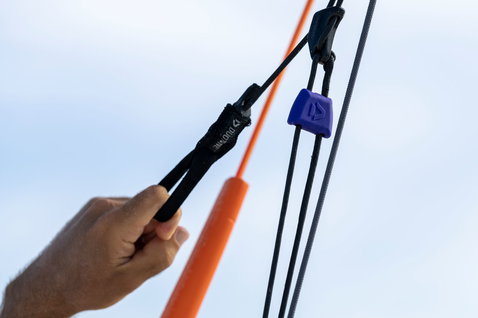 Duotone Trust Bar Quad Control control bar detail showing safety stopper and orange depower rope