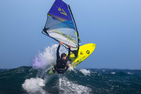 Duotone Cosmic D/LAB wave windsurf board during wave riding on the ocean