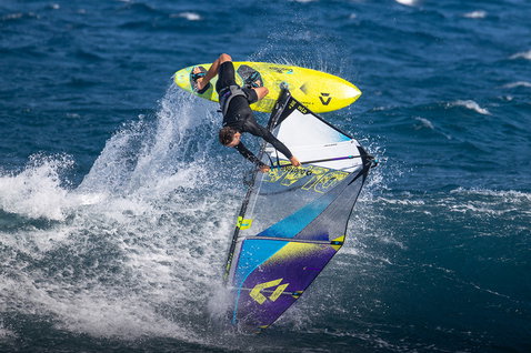 Duotone Cosmic D/LAB wave windsurf board during wave riding on the ocean