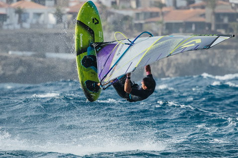 Duotone Skate D/LAB freestyle windsurf board during freestyle windsurfing aerial over the ocean