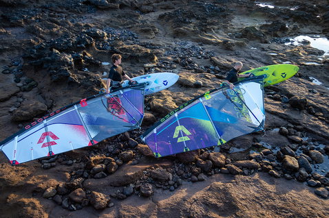 Duotone Super_Hero D/LAB wave windsurf sail during wave riding at a volcanic rocky coastline