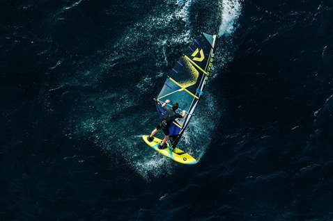 Duotone Idol freestyle windsurf sail during freestyle windsurfing on the open ocean, aerial view