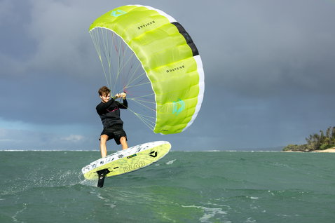 Duotone Skybrid D/LAB foil board during wing foiling on the ocean with lime green parawing