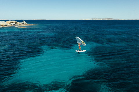 Duotone Skybrid Air foil board during wing foiling on turquoise ocean