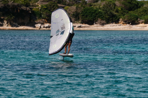 Duotone Skybrid Air foil board during wing foiling on the ocean in white